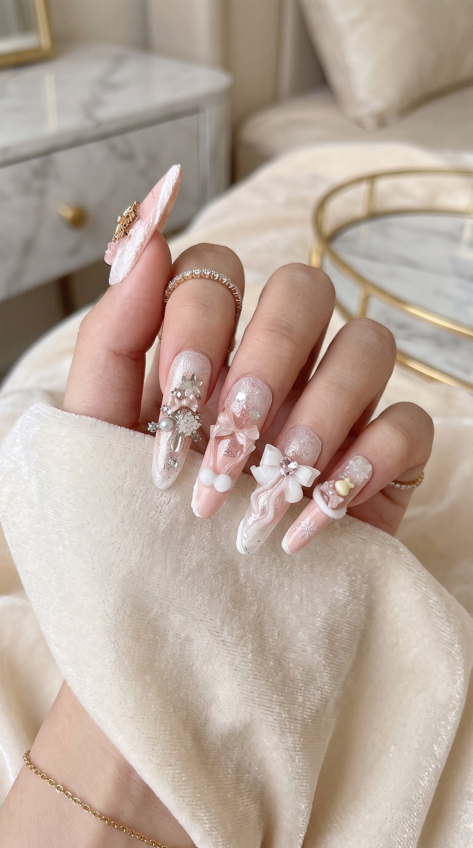 Long stiletto pink and white press-on nails worn on hand