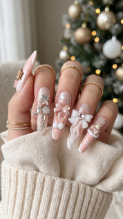 Long stiletto pink and white press-on nails worn on hand