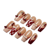 Cherry Ribbon Kiss long coffin press-on nail set featuring cherry red and nude pink French tips, 3D cherry charms, pearl bows, red-and-white plaid patterns, and glossy finishes.