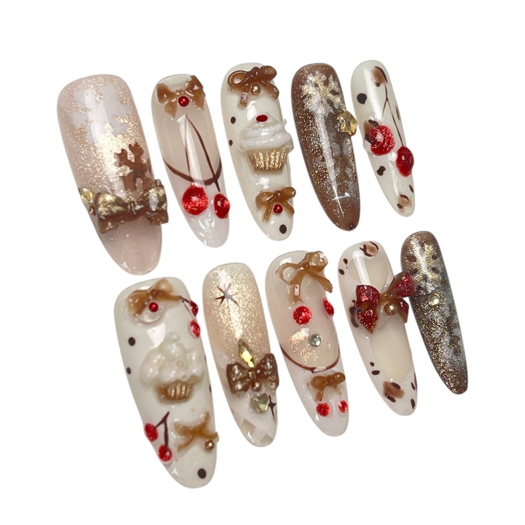 Gingerbread Wishes long almond press-on nail set featuring creamy ivory, champagne gold glitter, gingerbread-inspired nail art, 3D ribbon bows, red candy accents and sparkling stars.