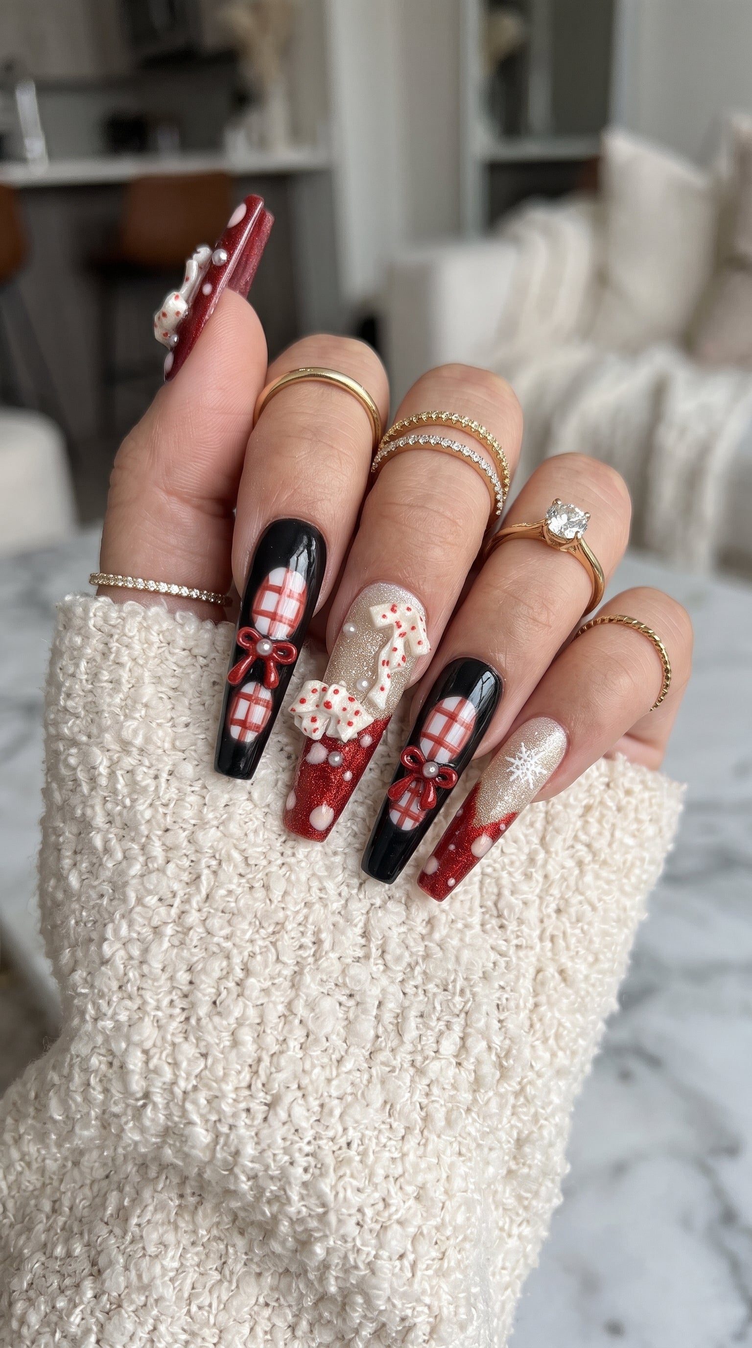 Midnight Candy Bows Christmas press-on nails worn on hand, featuring long coffin nails with red and black plaid designs, 3D candy canes, festive bows and sparkling snowflakes.